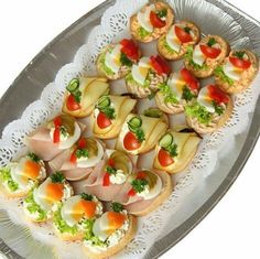 an assortment of appetizers are displayed on a platter