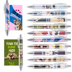 several pens with different animals on them and one pen has a notepad attached to it