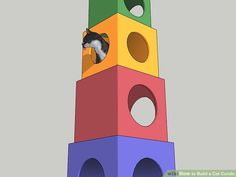 a cat climbing up the side of a tall tower