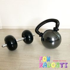 an exercise ball and barbell sit on the floor