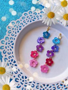 This listing is for ONE Pair of Rainbow Daisy Earrings. Hoops are hypoallergenic. If you wish to change gold to stainless steel silver or to replace hardware to posts or hooks or lever backs, please leave me a note at checkout. Follow me on IG for shop updates! @shopcosmiclovely Subscribe to my newsletter for exclusively monthly coupons! You can subscribe at: cosmiclovely.com Cheap Cute Multicolor Earrings, Blender Ideas, Earrings For Summer, Rainbow Daisy, Earring Inspo, Easter Earrings, Earrings Acrylic, Future Wardrobe, Acrylic Flower