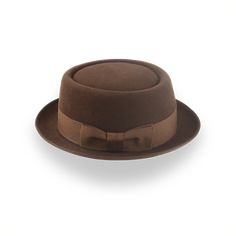 Description Materials Craftsmanship Hat Care Shipping Returns Product Description A Stylish Brown Men's Porkpie Hat Elevate your style with the Soul, a brown men's porkpie hat handcrafted from luxurious rabbit fur felt. Featuring a 3 1/2" telescope crown and a 1 3/4" raw-edge upturned brim, this hat offers a distinctive and sophisticated look. The 1 1/2" grosgrain ribbon hatband adds a touch of classic charm, while the viscose satin lining and genuine leather sweatband ensure all-day comfort and Porkpie Hat, Outdoor Hut, Hats For Big Heads, The Raid, Homburg, Crown Design, Hat Band, Rabbit Fur, Custom Hats