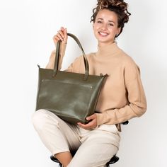 Handcrafted Olive Tote Bag Elevate your fashion game with our olive leather tote bag. This generously sized tote boasts a roomy exterior pocket, making it your ideal daily companion, especially when you're toting your laptop. It not only offers practicality but also keeps you at the forefront of style. Crafted from enduring full-grain leather with an elegant matte olive finish, this tote is a testament to durability. Handmade with Devotion: Our dedicated team from The Netherlands puts their hear Green Tote Weekender Bag For On-the-go, Everyday Green Satchel With Zipper Pocket, Khaki Tote Satchel For Everyday, Green Everyday Satchel With Zipper Pocket, Modern Khaki Tote Bag, Modern Olive Bags For Everyday Use, Everyday Khaki Satchel With Zipper Pocket, Modern Olive Shoulder Bag For Everyday, Khaki Top Handle Satchel For Everyday Use