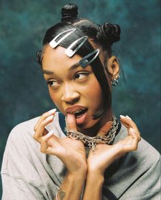 a woman making a funny face with her hands