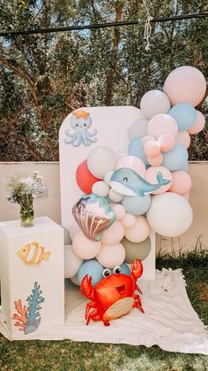 an ocean themed birthday party with balloons and decorations