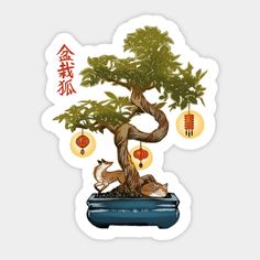 a bonsai tree with lanterns hanging from it's branches and two deers