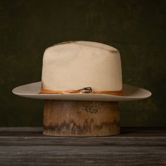 The Wazee is the latest style in our NINE7O Collection. The Wazee is a hat made for uptown, downtown, ranch life, and everything in between. This new take on a classic fedora with some distressing and leather detail is sure to become your go-to hat! The Wazee Details: Buckskin Fashion Weight 6" Tapered Crown 3" Brim Width Keenland Crown Shape Soft Snap Brim Flex Fit Sweatband Mild Distressing Tandy Leather cording with a safety pin accent No Liner Note: This is a Unisex style. If you are not sur Fitted Panama Hat For Western-themed Events, Western Style Brimmed Panama Hat In Fur Felt, Western Style Brimmed Fur Felt Panama Hat, Fitted Western Style Panama Hat For Western-themed Events, Fitted Western-style Panama Hat For Western-themed Events, Flat Crown Fedora For Kentucky Derby And Western Events, Flat Crown Fedora For Kentucky Derby, Fitted Fedora Hat For Ranch, Fitted Fedora For Ranch