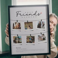 a woman holding up a frame with photos hanging on it that says best friends forever