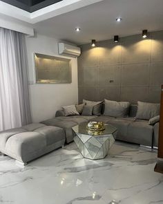 a modern living room with marble floors and walls