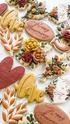 decorated cookies are displayed on a table