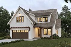 this is an artist's rendering of the modern farmhouse style house plan with two garages