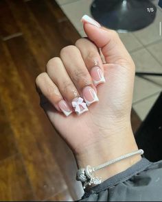 Short White French Tips With Design, Medium Nail Sets, White Frenchies Nails, Short French Tip Acrylic Nails With Cross, Nails With White Designs, Short White Acrylic Nails With Charms, French Nails With Cross Charm, Short Acrylic Nails Black Women, French Tip With Cross Charm