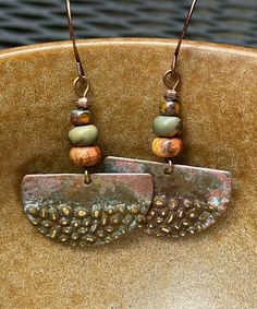 Rustic antique Hammered copper dangle earrings with jasper stones.  Looking for something lightweight, unique and natural? This simple yet elegant pair of hammered copper earrings will definitely make you smile!  These earrings have a very unique hammered texture. The color of the copper changes with the light. They have an antique patina finish for a rustic look. The stones are varieties of jasper.  These earrings are 1 inch in diameter. They are very light weight, less than 3 grams. The French Copper Earrings Handmade, Jewelry Hoop Earrings, Hammered Copper Earrings, Hammered Jewelry, Natural Stone Earrings, Paper Earrings, Earrings Antique, Recycled Jewelry, Natural Stone Jewelry