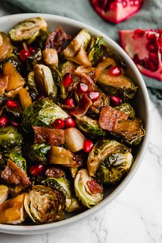 brussel sprouts with bacon and pomegranate in a white bowl