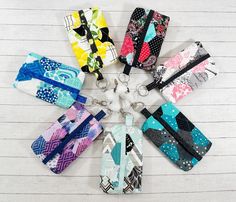 six keychains with different patterns and designs on them