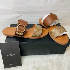 New Women Coach Hallie Signatire Sandals Kahki / Saddle Leather Size 5.5 Comes In Original Box Beige Leather Slides With Flat Heel, Beige Leather Mules With Ankle Strap, Beige Leather Ankle Strap Mules, Chic Leather Sandals With Leather Trim, Leather Open Toe Slides, Designer Beach Sandals With Heel Strap, Chic Brown Leather Slides, Coach Mules For Spring, Leather Footbed Ankle Strap Mules