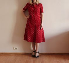 "Vintage Dress Red Women Dress Short Sleeve Dress Red Button up Secretary Dress A-Line Polyester Dress Lined Shoulder Pads Shown on model M/L Measurements: (lying flat) Shoulder: 15\"/ 38 cm Sleeve: 9.5\"/ 24 cm Bust: 18.5\"/ 47 cm Waist: 16.5\"/ 42 cm Length: 44\"/ 112 cm Please check measurements to insure a proper fit. Remember to allow yourself some extra room for movement. You can compare these with something from your closet that fits you well Condition: great Vintage Condition N.B. Color may slightly differ from picture. SHIPPING * I ship worldwide via Priority mail * Items are shipped 3 - 5 business days after receiving the payment. * I ship from Europe, so please allow 2 to 3 weeks for the package to arrive if you live overseas. * Europe 5 - 10 business days. BK 2" Red A-line Midi Dress With Buttons, Red Knee-length Vintage Summer Dress, Red Midi Dress With Button Closure, Red Buttoned Midi Dress For Spring, Spring Red Midi Dress With Buttons, Red Buttoned Midi Dress For Summer, Elegant Red Button-up Dress, Retro Knee-length Midi Dress With Buttons, Red Summer Midi Dress With Buttons