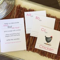 three children's worksheets are sitting on a tray with bamboo sticks in front of them