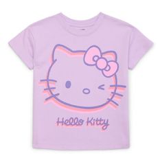 a purple hello kitty t - shirt with an image of a cat on the front