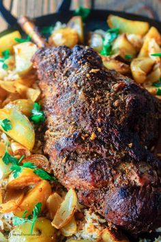 a close up of a plate of food with meat and potatoes