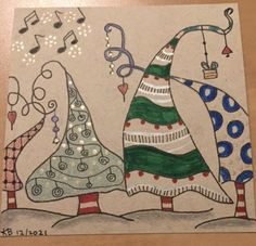 a drawing of two christmas trees with musical notes