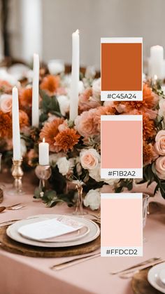 a table with candles, plates and flowers in shades of pink, orange, and white