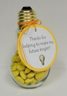 a jar filled with yellow candies and a tag that says thanks for helping to make my future bright