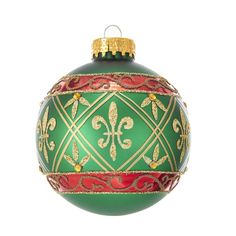 a green and red ornament hanging from a tree branch in front of a white background