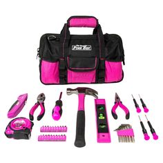 a pink tool kit with tools in it and its contents laid out on a white background