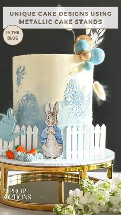 a white cake with blue frosting and an image of a rabbit on it's side