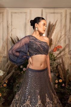 A slate-grey lehenga with bold floral chevron embroidery is paired with a one-shoulder blouse and dupatta.by Chamee and Palak. DELIVERY TIMEPlease allow 4-6 months for your outfit to arrive. FABRIC DETAILSRaw silk, Net. Simple Dupatta, Chevron Embroidery, Grey Lehenga, Blouse Simple, Gray Silk, Silk Lehenga, Custom Bridal, Puff Sleeve Blouse, Wedding Outfits