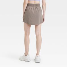 Why we're ALL IN: Woven mid-rise skort with built-in shorts in a regular-fit silhouette makes a cool choice for your active days. Moisture-wicking, quick-dry lightweight fabric helps you stay cool, while a drawcord elastic waistband provides a snug fit. Side pocket provides hands-free convenience and the UPF 50+ rating offers sun protection. All in Motion™: Made for every move, priced for every day. Casual Training Skort With Built-in Shorts, Casual Short Skort For Training, Casual Short Training Skort, Casual Skort With Built-in Shorts For Running, Casual Training Shorts With 5-inch Inseam, Versatile Sports Skort In Short Length, Versatile Sports Skort, Short Length, Versatile Sports Skort Short Length, Casual Moisture-wicking Skort For Training