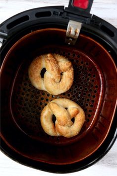 air fryer soft pretzels in an air fryer with the words, air fryer soft pretzels