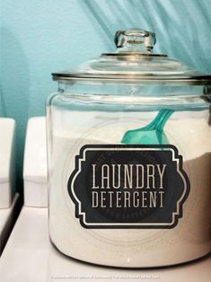 a glass jar filled with laundry detergent on top of a counter