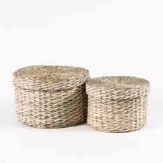 two wicker baskets sitting next to each other