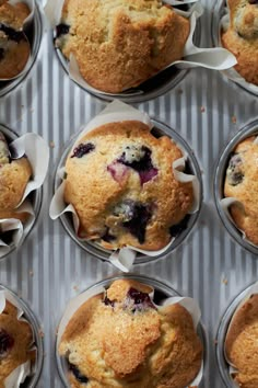 blueberry muffins are in the pan ready to be eaten