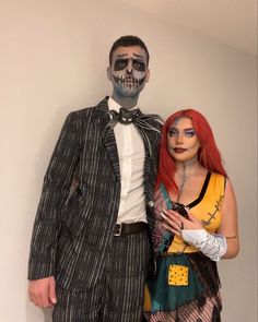 a man and woman dressed up in costumes