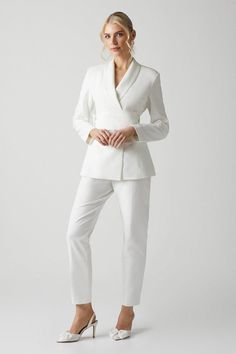 Made for innovative brides who favour uniqueness, this blazer style mixes feminine and masculine in a refreshing way. Designed with forever in mind, it features shawl lapels, padded shoulders and a dramatic bow-embellished belt at the waist. Made from satin back crepe: cut from a luxuriously smooth crepe with a subtle sheen to the back, this fabric drapes softly over your silhouette for a figure skimming finish. Level of stretch: little. This jacket fastens with front concealed buttons. Bridal Blazer, Feminine And Masculine, Occasion Dresses Wedding Guest, Organza Bow, Embellished Belt, Petite Jumpsuit, Petite Coat, Blazer Style, Tall Clothing