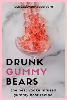 pink gummy bears in a glass bowl with the words drunk gummy bears on it