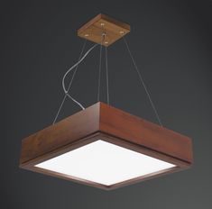 a wooden light fixture hanging from the ceiling