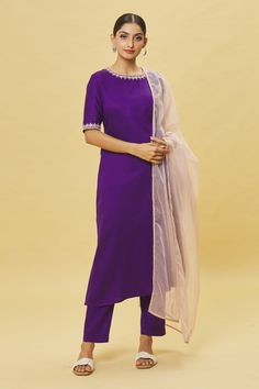 Purple straight kurta featuring cutdana embroidered detailing on neck and sleeves. Comes with matching pant and contrast sheer dupatta.
Components: 3
Pattern: Embroidered
Type Of Work: Cutdana
Neckline: Round
Sleeve Type: Three quarter
Fabric: Jama Cotton
Color: Purple
Other Details: 
Back keyhole closure
Straight silhouette
Occasion: Mehendi and Haldi - Aza Fashions Elegant Straight Kurta Set With Cutdana, Bollywood Style Traditional Wear With Silk Thread, Elegant Fitted Dupatta With Gota Work, Bollywood Traditional Wear Made Of Silk Thread, Traditional Wear Tissue Silk Straight Kurta For Reception, Tissue Silk Traditional Wear With Straight Kurta For Reception, Elegant Unstitched Suit With Embroidered Border For Festive Season, Wedding Straight Kurta Sets With Embroidered Border, Reception Traditional Wear In Tissue Silk With Straight Kurta