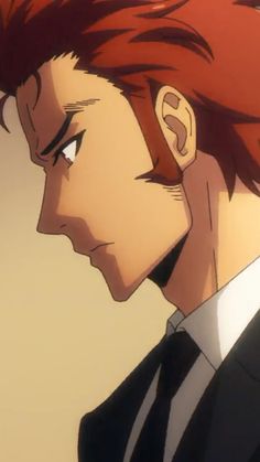 a man with red hair wearing a suit and tie looking off to the side in front of him