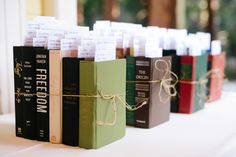 several books tied with twine and sitting on top of a white tablecloth covered table