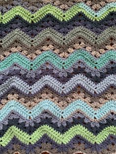 a crocheted blanket with waves on it