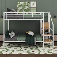 a white bunk bed sitting on top of a wooden floor next to a green wall