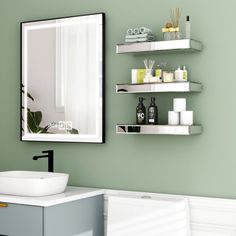 a bathroom sink sitting under a mirror next to a shelf