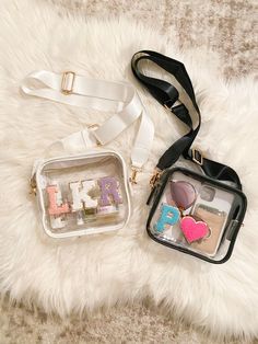 This clear crossbody bag with patches is perfect for game day, stadium, concerts + festivals! •Choice of white or black bag •Gold color zipper closure •Bag measures approximately 7" X 6" X 2" •Made of waterproof faux leather for easy cleaning •Adjustable strap •Option to add letter patches A-Z in white, purple, light pink, hot pink, mint, or blue and fun specialty patches! Clear Belt Bag, Clear Game Day Purses, Rebelde Concert, Bag With Patches, Christmas Gift Her, Concert Bag, Concert Bags, Clear Stadium Bag, Personalized Purse