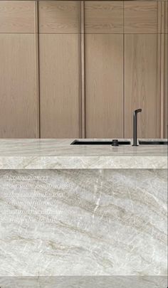 a white marble counter top in a kitchen