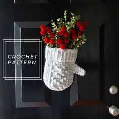 a crochet boot with flowers in it hanging on a door handle that says crochet pattern