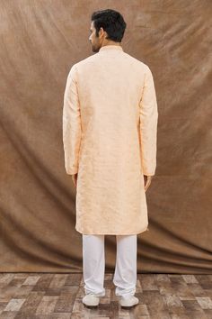 Pastel coral kurta with floral embroidery and mandarin collar. Paired with churidar.
Component: 2
Pattern: Embroidered
Type Of Work: Floral
Neckline: Mandarin
Sleeve Type: Full Sleeves
Fabric: Cotton
Color: Coral
Other Details: 
Front buttons
Mandarin neck
Occasion: Puja - Aza Fashions Kurta Set For Men, Color Coral, Churidar, Kurta Set, Full Sleeves, Mandarin Collar, Aza Fashion, Full Sleeve, Fabric Cotton